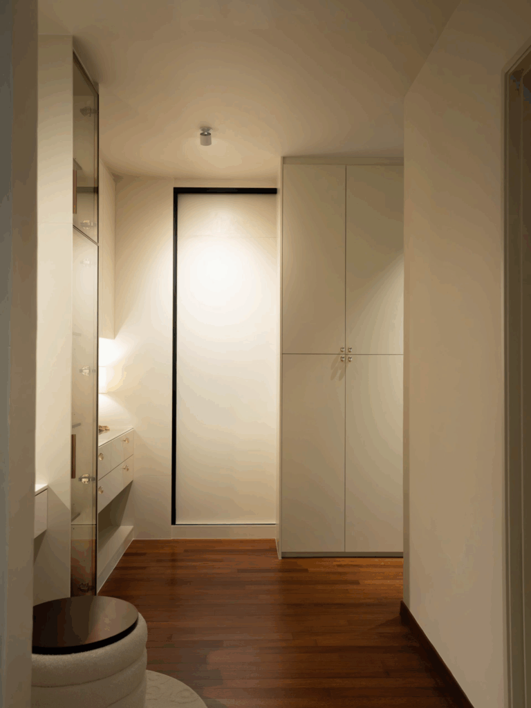 A walk-in wardrobe is a dedicated storage area that allows you to physically enter the wardrobe space.